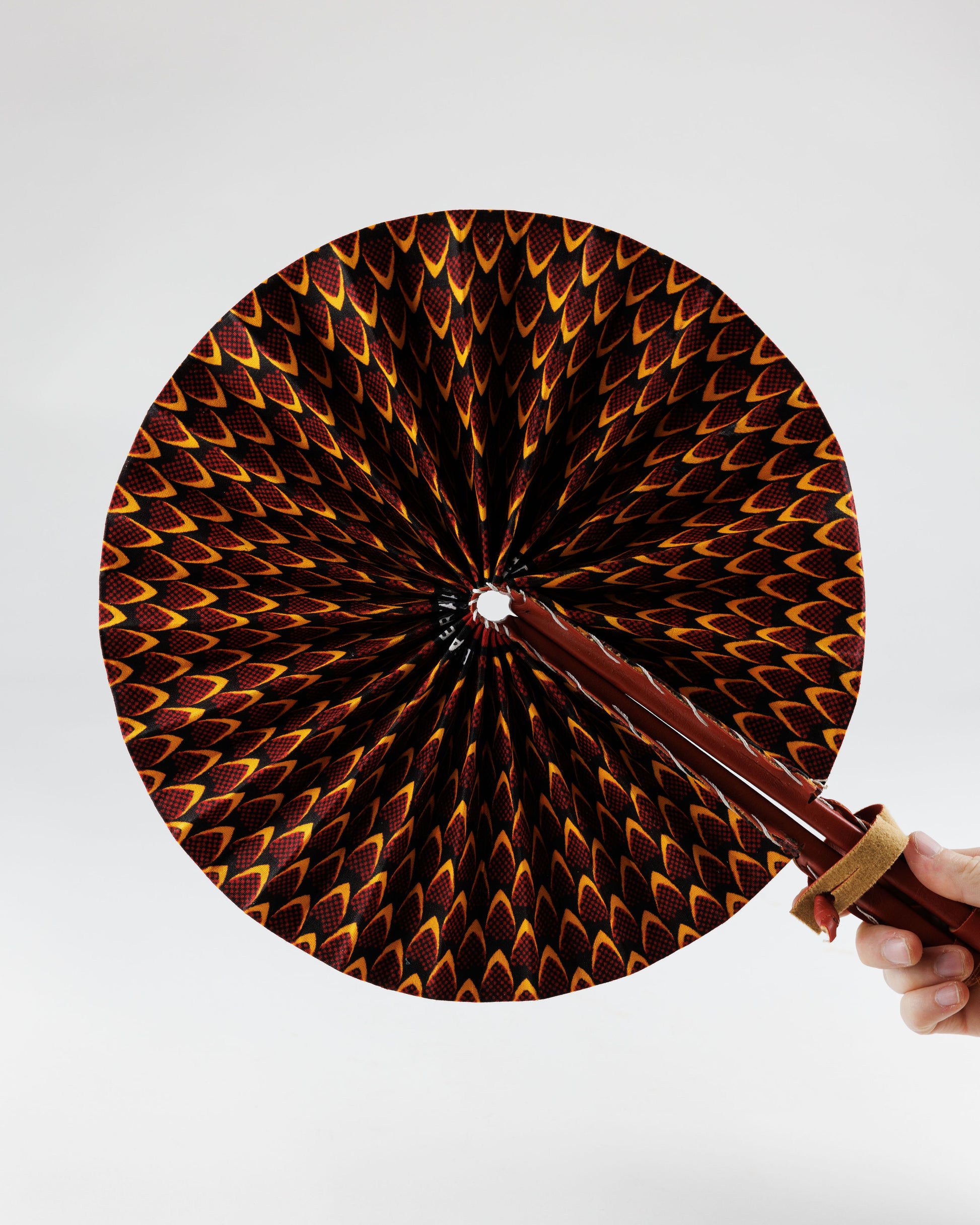 Fan- Collapses for easy storage, made from African wax fabric