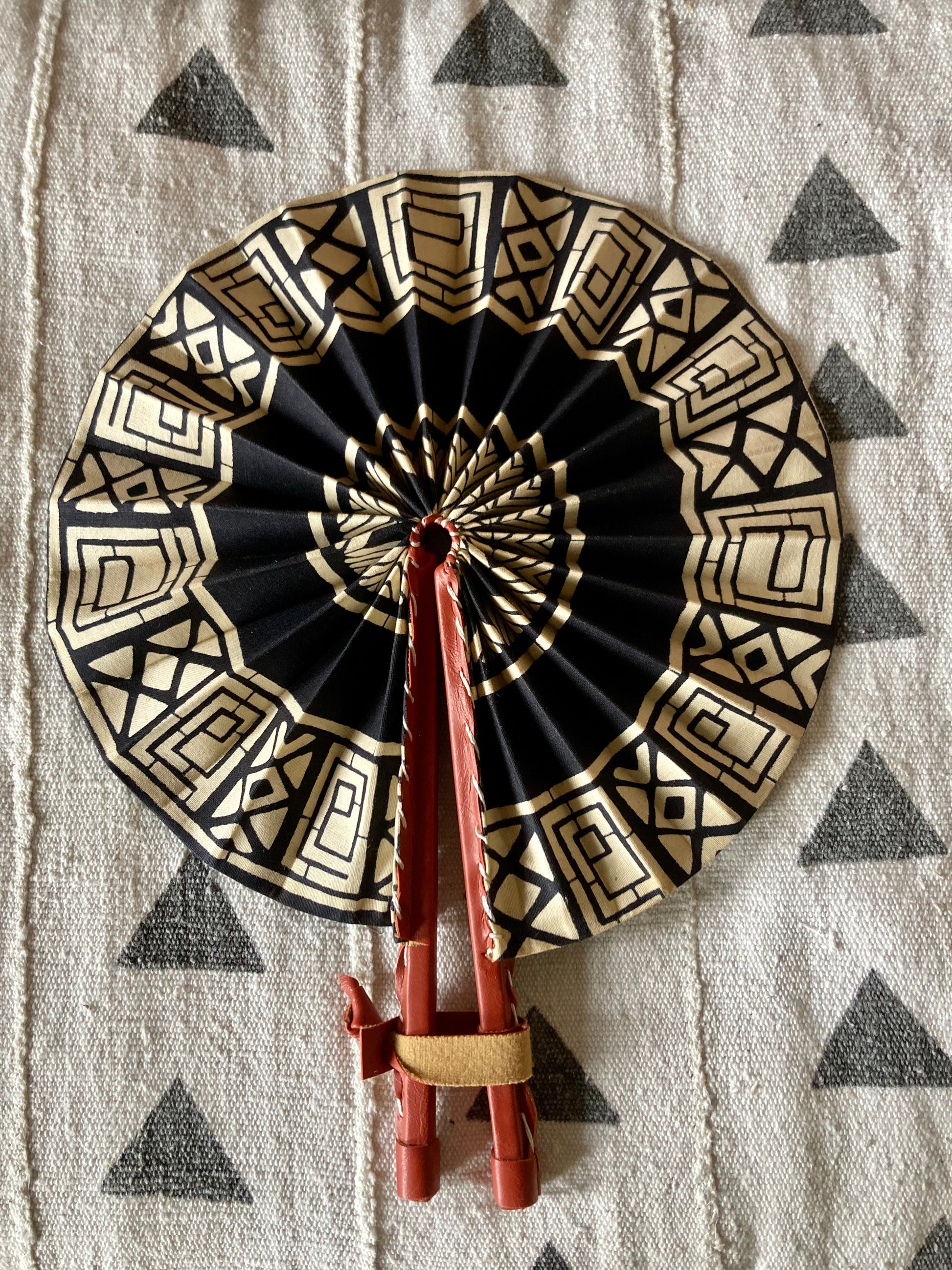 Fan- Collapses for easy storage, made from African wax fabric