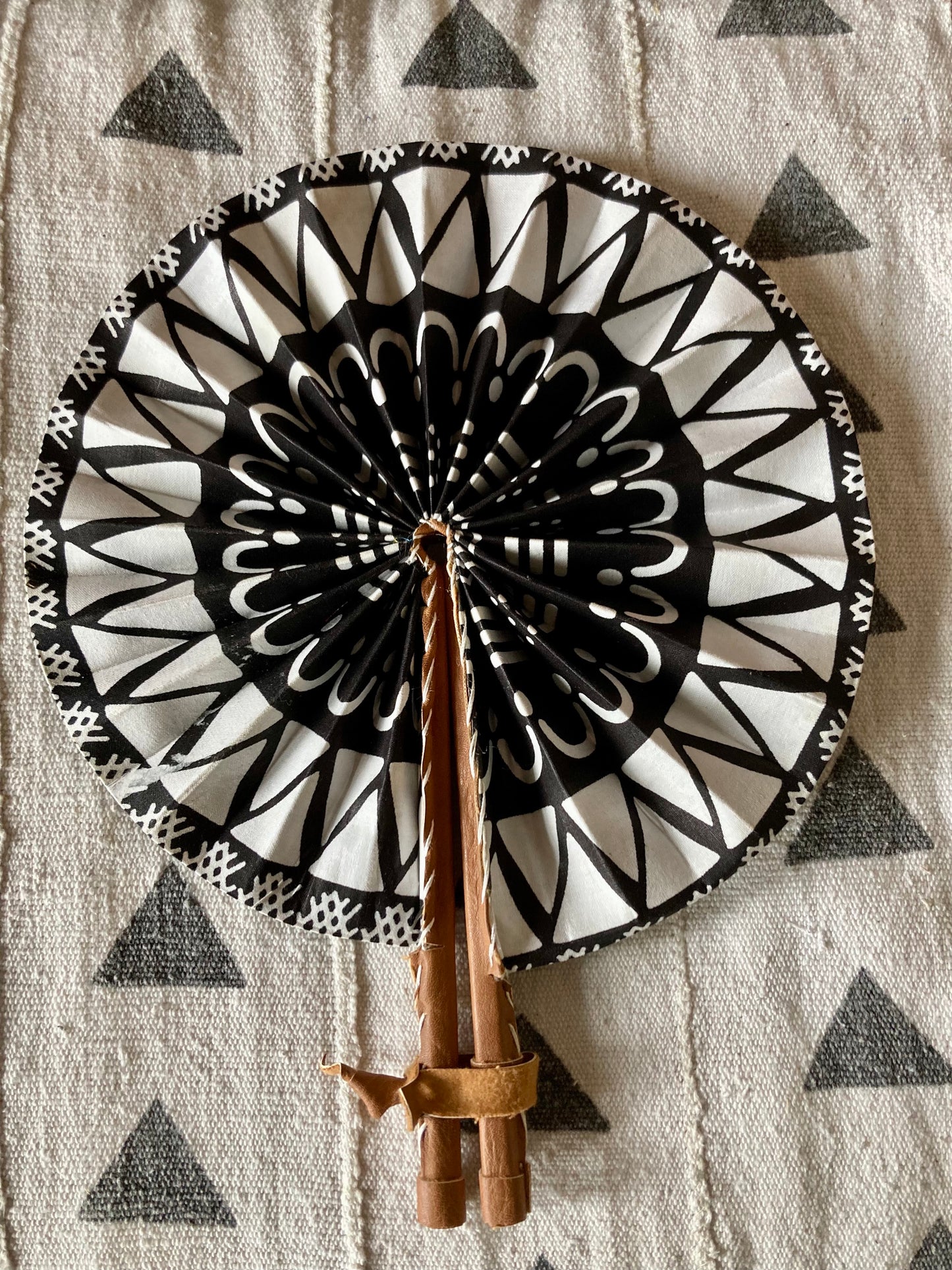 Fan- Collapses for easy storage, made from African wax fabric