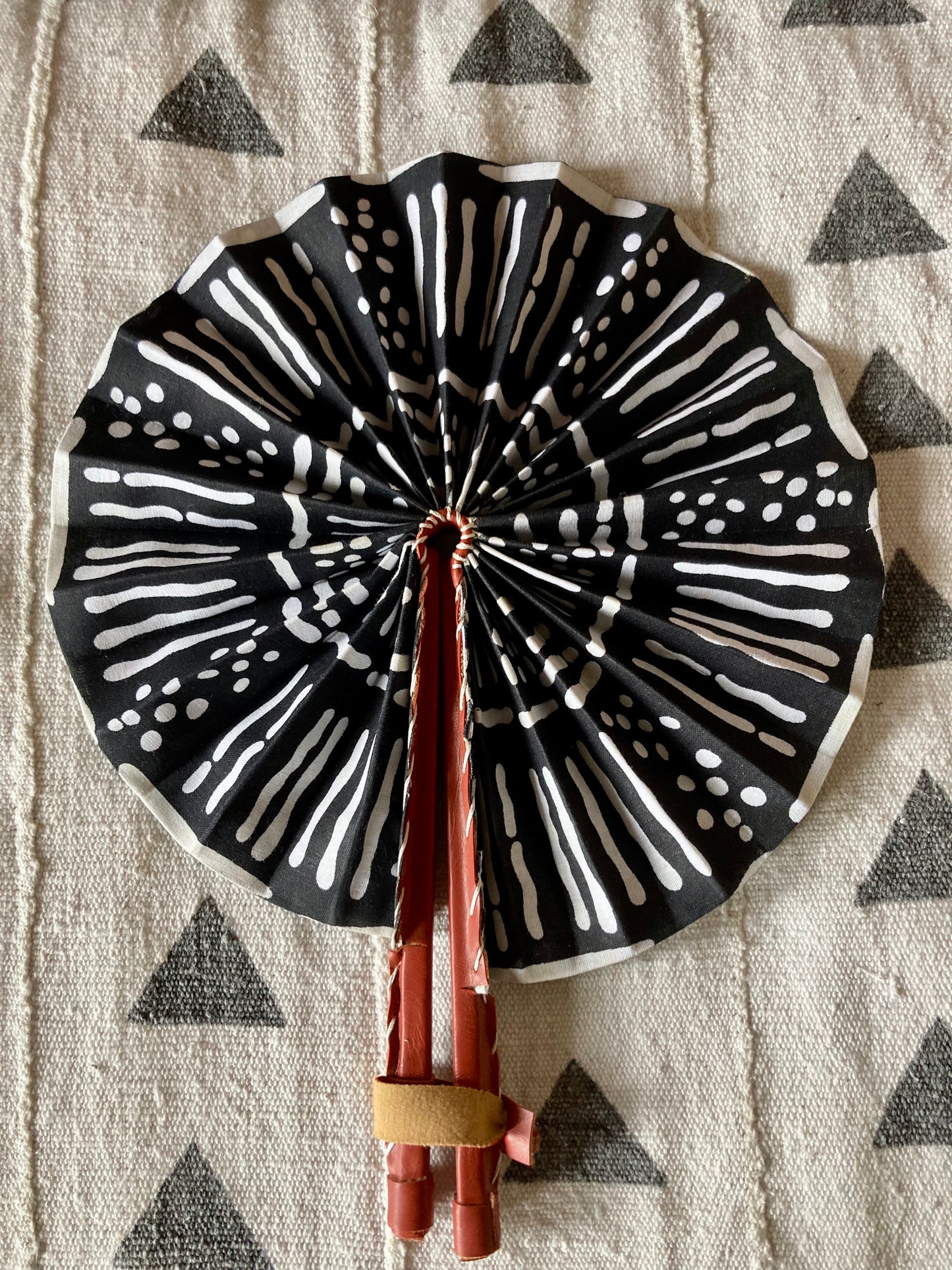 Fan- Collapses for easy storage, made from African wax fabric